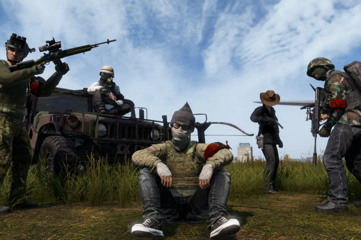 A group of armed survivors gathered around a truck in DayZ